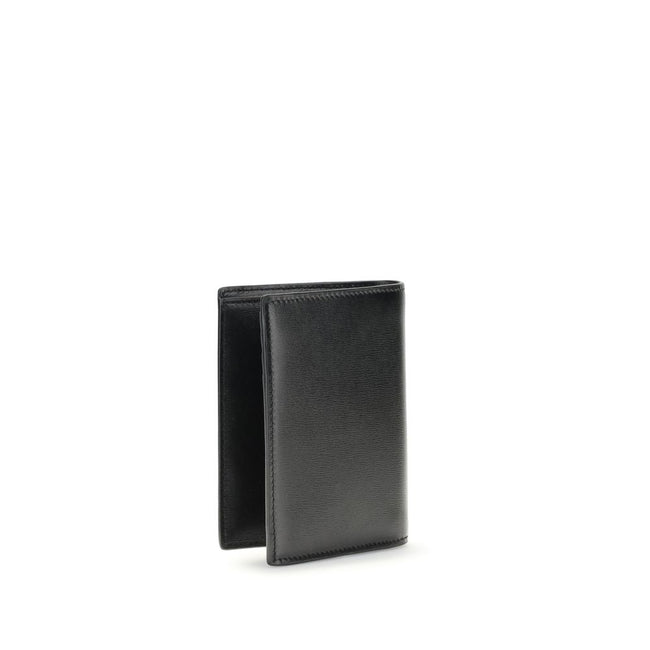 Black Calf Leather Bos Taurus WalletThe Tiny Cassandre credit Card Holder by Saint Laurent is a compact and sophisticated accessory designed for discreet elegance. Crafted with attention to detail, it is embellished with the YSL initials in pint-sized met