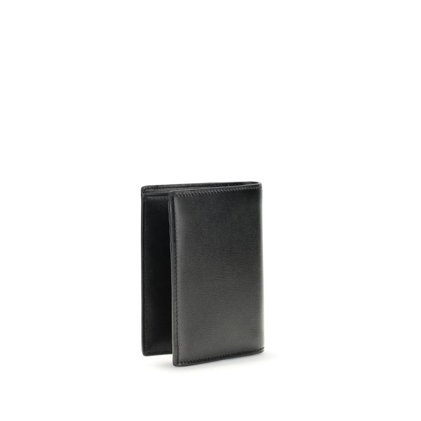 Black Calf Leather Bos Taurus WalletThe Tiny Cassandre credit Card Holder by Saint Laurent is a compact and sophisticated accessory designed for discreet elegance. Crafted with attention to detail, it is embellished with the YSL initials in pint-sized met
