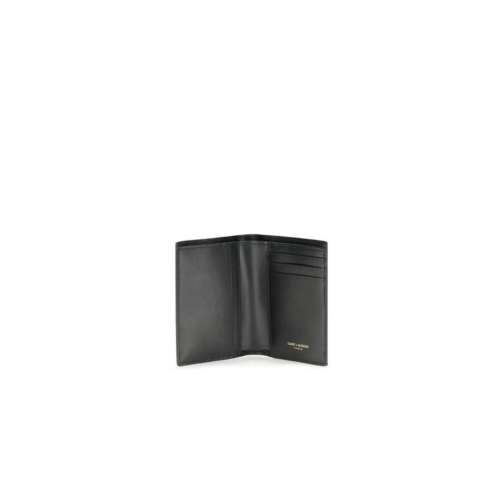 Black Calf Leather Bos Taurus WalletThe Tiny Cassandre credit Card Holder by Saint Laurent is a compact and sophisticated accessory designed for discreet elegance. Crafted with attention to detail, it is embellished with the YSL initials in pint-sized met