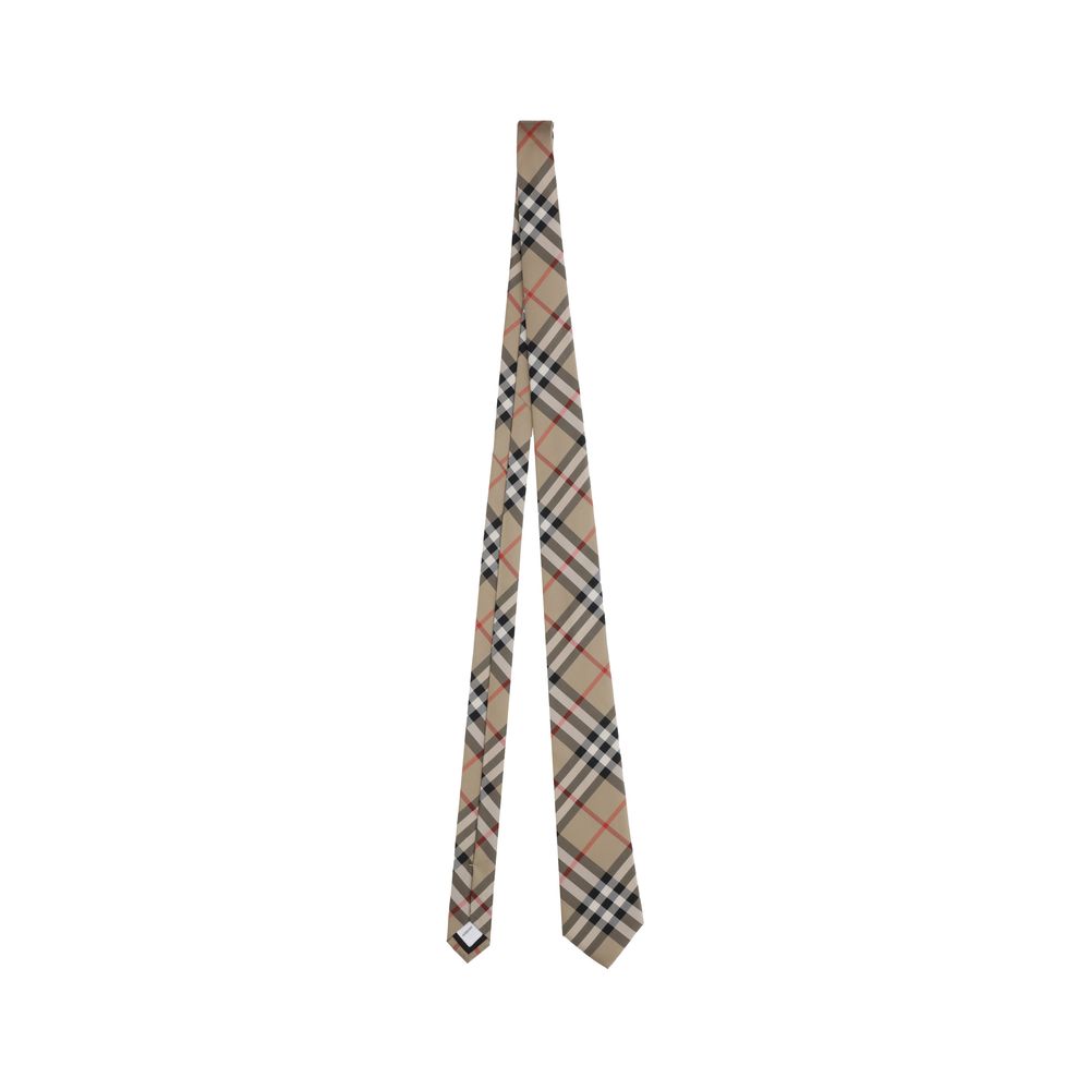 Manston TiesBurberry’s Manston Tie is a timeless accessory that celebrates the brand’s visual identity. Crafted with painstaking care, it is embellished with the iconic Archivio Check print, a distinctive symbol of Burberry style. Elegant and recognizable