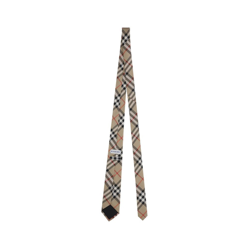 Manston TiesBurberry’s Manston Tie is a timeless accessory that celebrates the brand’s visual identity. Crafted with painstaking care, it is embellished with the iconic Archivio Check print, a distinctive symbol of Burberry style. Elegant and recognizable