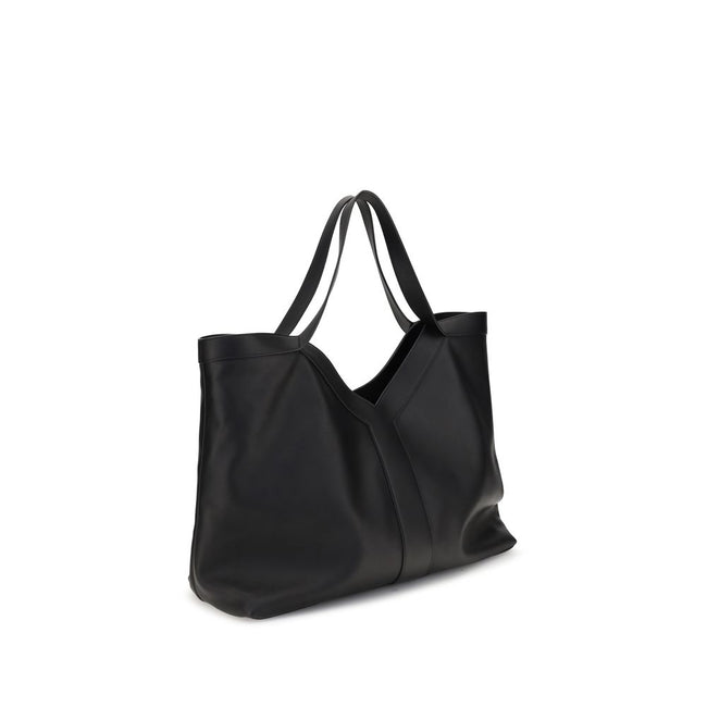 Black Calf Leather Bos Taurus Shoulder BagThe large Y Tote Bag by Saint Laurent is an elegant interpretation of the maison’s essential design. Crafted from finely grained leather and fully lined in tone-on-tone suede, it features the refined Y signature i
