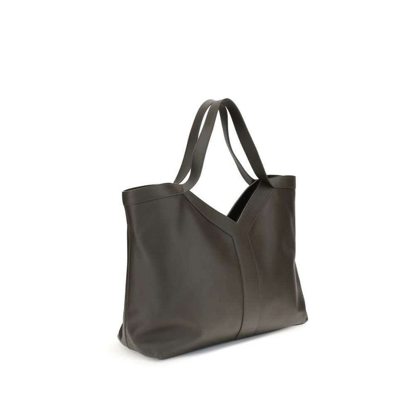 Green Calf Leather Bos Taurus Shoulder BagSaint Laurent’s oversized Y Tote Bag combines capacity and elegance in an essential and sophisticated design. Made of smooth leather and fully lined in tone-on-tone suede, it is embellished with the signature Y in