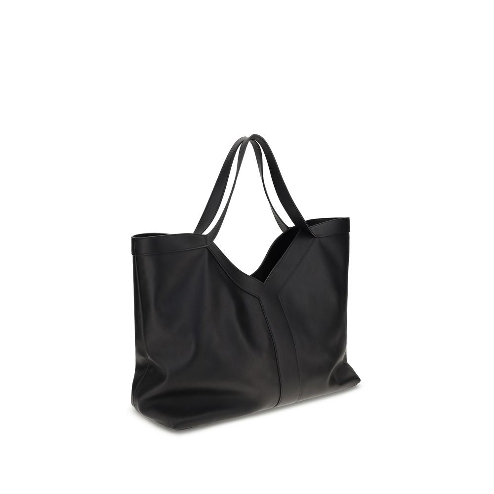 Black Calf Leather Bos Taurus Shoulder BagThe large Y Tote Bag by Saint Laurent is an elegant interpretation of the maison’s essential design. Crafted from finely grained leather and fully lined in tone-on-tone suede, it features the refined Y signature i
