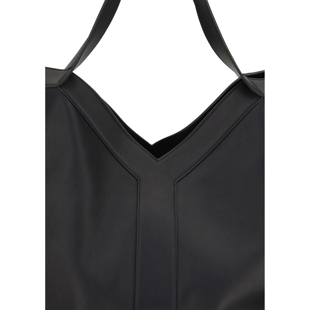 Black Calf Leather Bos Taurus Shoulder BagThe large Y Tote Bag by Saint Laurent is an elegant interpretation of the maison’s essential design. Crafted from finely grained leather and fully lined in tone-on-tone suede, it features the refined Y signature i