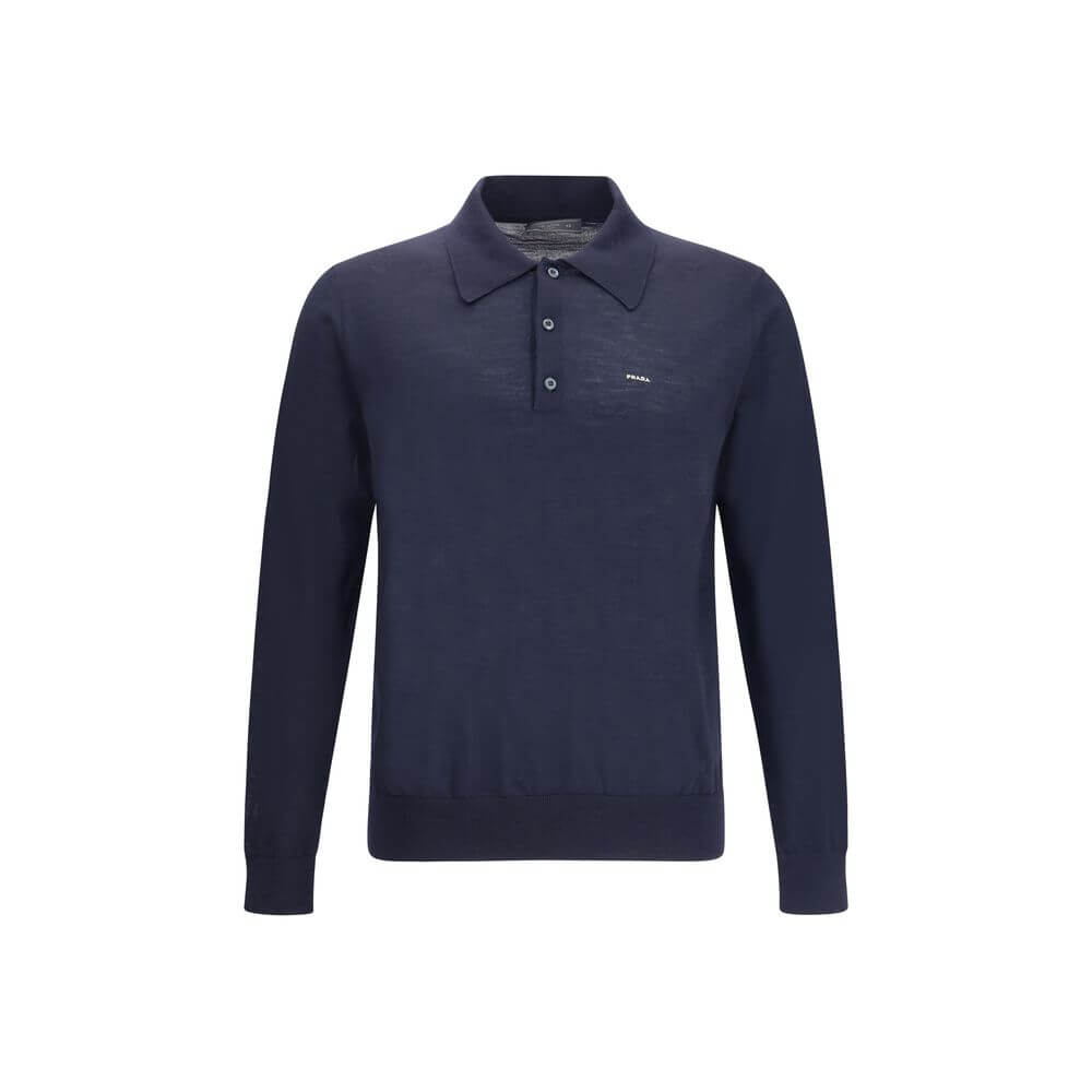 Wool Polo SweaterPrada’s Polo Sweater combines sporty elegance with iconic details. Featuring a classic collar and three-button front closure, it has ribbed cuffs and hem for a flawless finish. The contrasting embroidered logo on the front signs the garme