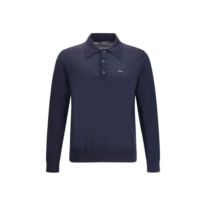 Wool Polo SweaterPrada’s Polo Sweater combines sporty elegance with iconic details. Featuring a classic collar and three-button front closure, it has ribbed cuffs and hem for a flawless finish. The contrasting embroidered logo on the front signs the garme