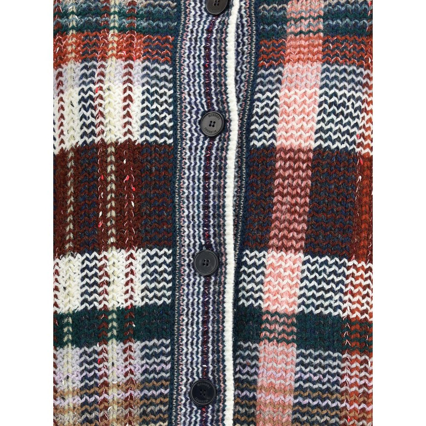 Multicolor Wool CardiganThe abstract-print Cardigan by Missoni embodies the brand’s unmistakable identity through a design that balances comfort and refinement. A V-neckline and button closure define its versatile silhouette, while front pockets and ribbe