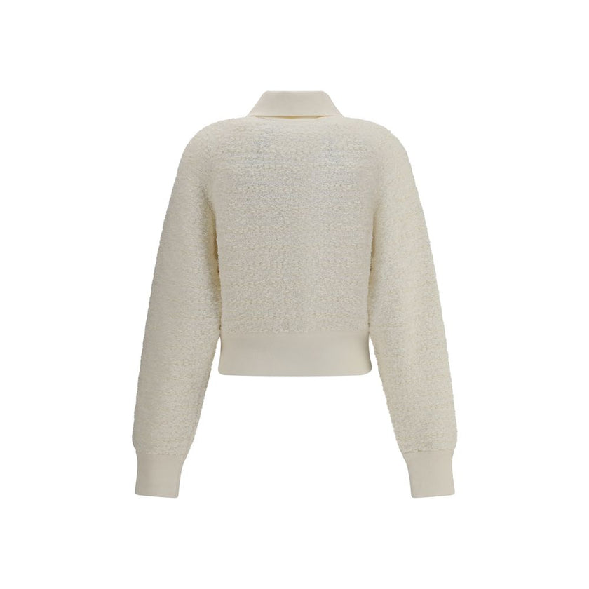 White Viscose BomberThe Tweed Bomber Jacket by Balmain reimagines a sporty classic with the Maison’s unmistakable elegance. Featuring a high collar and batwing long sleeves, it offers volume and modernity, while the decorative side pockets are detailed wi