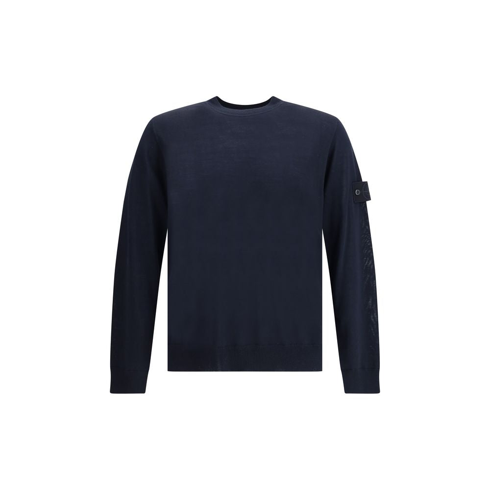 Virgin Wool SweaterThe Stone Island Sweater is crafted from 100% virgin wool and defined by its clean design and the brand’s iconic details. It features a round neck, long sleeves, a logo patch on the sleeve, and ribbed cuffs and hem for comfort and a per