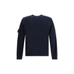 Virgin Wool SweaterThe Stone Island Sweater is crafted from 100% virgin wool and defined by its clean design and the brand’s iconic details. It features a round neck, long sleeves, a logo patch on the sleeve, and ribbed cuffs and hem for comfort and a per