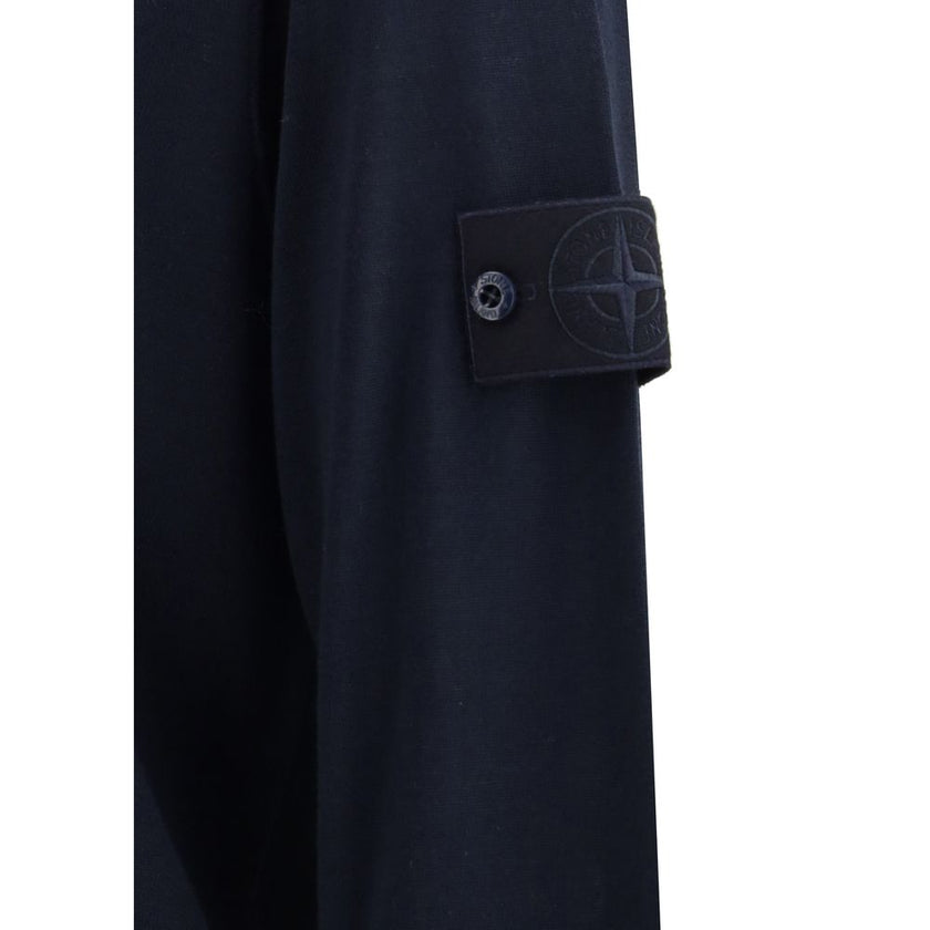 Virgin Wool SweaterThe Stone Island Sweater is crafted from 100% virgin wool and defined by its clean design and the brand’s iconic details. It features a round neck, long sleeves, a logo patch on the sleeve, and ribbed cuffs and hem for comfort and a per