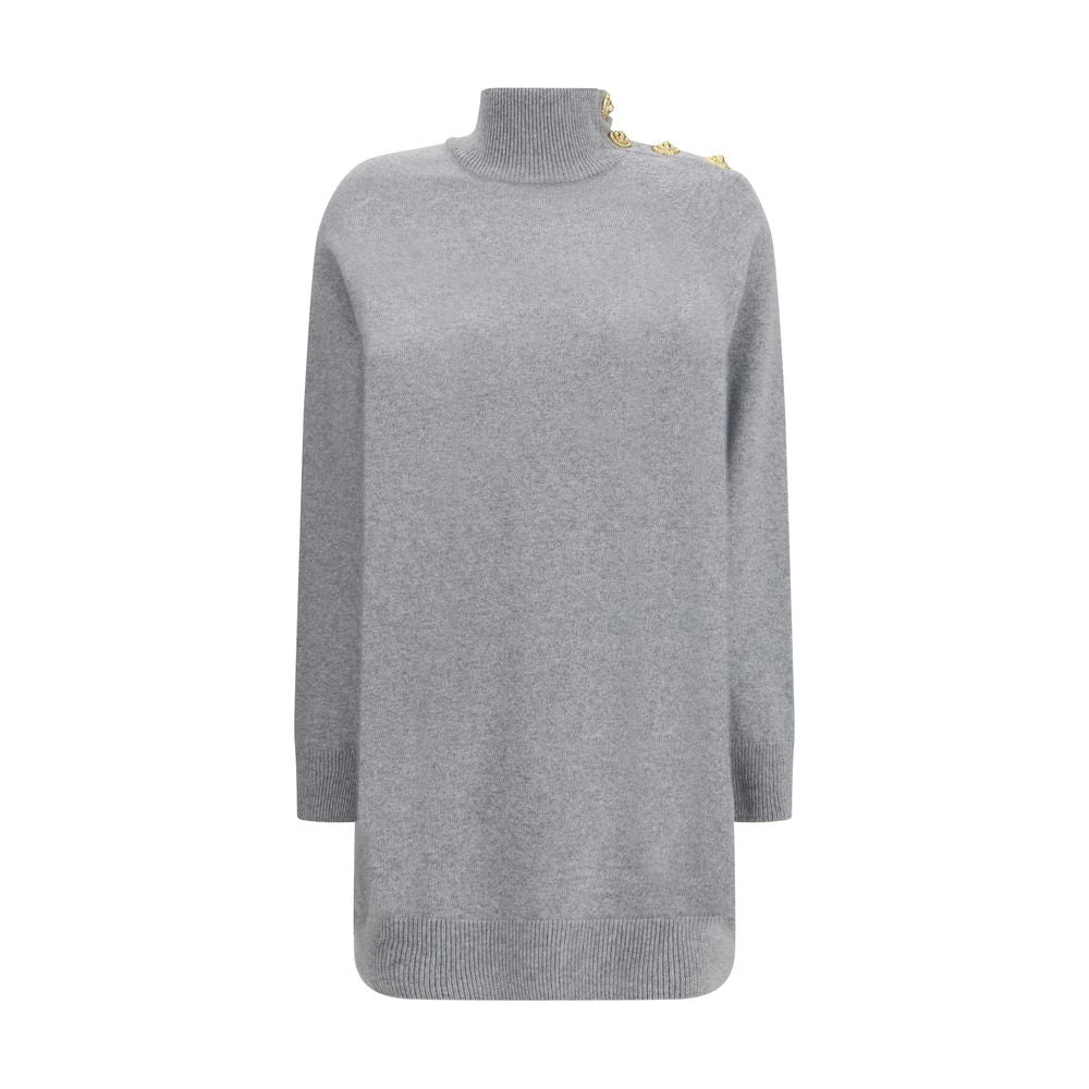 Gray Cashmere Casual DressThe Short Cashmere Sweater Dress by Balmain combines the softness of eco-friendly cashmere with a design of strong character. The high neck is detailed with a four-snap closure concealed under the placket, while decorative “Lion