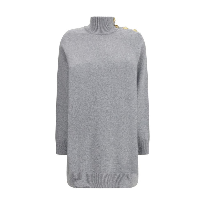 Gray Cashmere Casual DressThe Short Cashmere Sweater Dress by Balmain combines the softness of eco-friendly cashmere with a design of strong character. The high neck is detailed with a four-snap closure concealed under the placket, while decorative “Lion