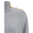 Gray Cashmere Casual DressThe Short Cashmere Sweater Dress by Balmain combines the softness of eco-friendly cashmere with a design of strong character. The high neck is detailed with a four-snap closure concealed under the placket, while decorative “Lion