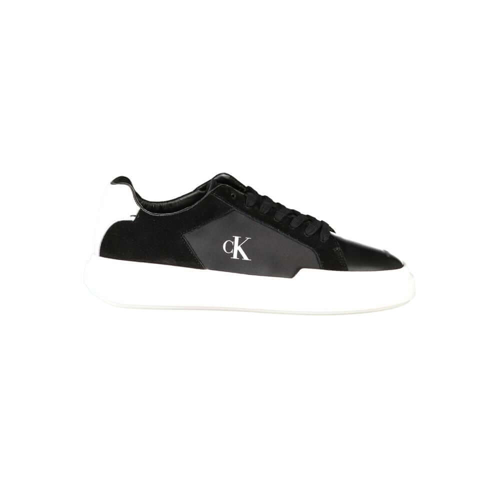 Black Leather Men SneakerEmbark on a sartorial journey with the audacious spirit of Calvin Klein. These sneakers aren’t just footwear; they are a statement of contrast and sophistication. Designed to captivate with their bold black base and striking white