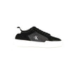 Black Leather Men SneakerEmbark on a sartorial journey with the audacious spirit of Calvin Klein. These sneakers aren’t just footwear; they are a statement of contrast and sophistication. Designed to captivate with their bold black base and striking white