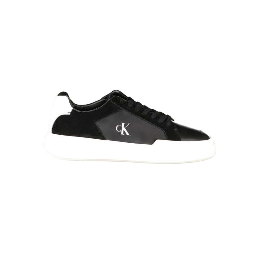 Black Leather Men SneakerEmbark on a sartorial journey with the audacious spirit of Calvin Klein. These sneakers aren’t just footwear; they are a statement of contrast and sophistication. Designed to captivate with their bold black base and striking white