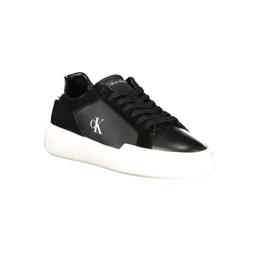 Black Leather Men SneakerEmbark on a sartorial journey with the audacious spirit of Calvin Klein. These sneakers aren’t just footwear; they are a statement of contrast and sophistication. Designed to captivate with their bold black base and striking white