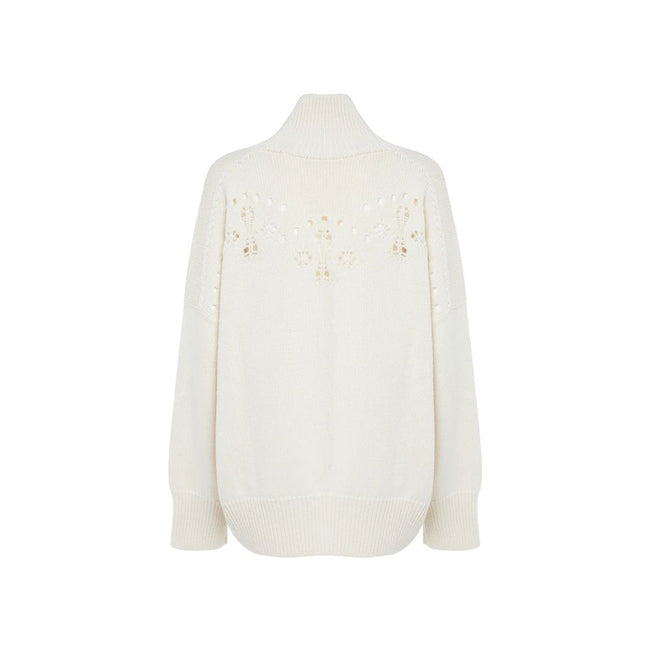 White Wool SweaterDescription: – Composition: 100% Wool – Long sleeves – Ribbed trims – Hand wash – High neck – Pointelle knit – Perforated detailing – Drop shoulder – Bishop sleeves – Made in Italy – Gender: WOMEN –White Wool Sweater${tagsChloéAulae Whit