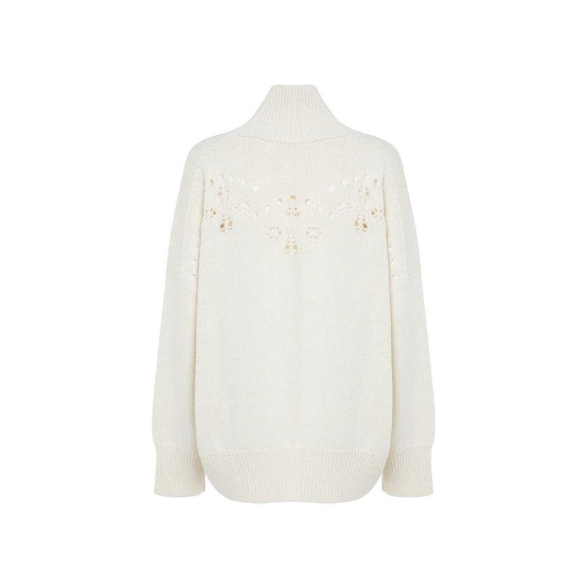 White Wool SweaterDescription: – Composition: 100% Wool – Long sleeves – Ribbed trims – Hand wash – High neck – Pointelle knit – Perforated detailing – Drop shoulder – Bishop sleeves – Made in Italy – Gender: WOMEN –White Wool Sweater${tagsChloéAulae Whit