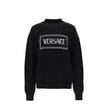Black Wool SweatshirtDescription: – Composition: 100% Wool – Long sleeves – Round neck – Ribbed trims – The model is 177 cm tall and wears size IT 38 – Made in Italy – Gender: WOMEN –Black Wool Sweatshirt${tagsVersaceAulae Logo Sweater VersaceAulae Logo S