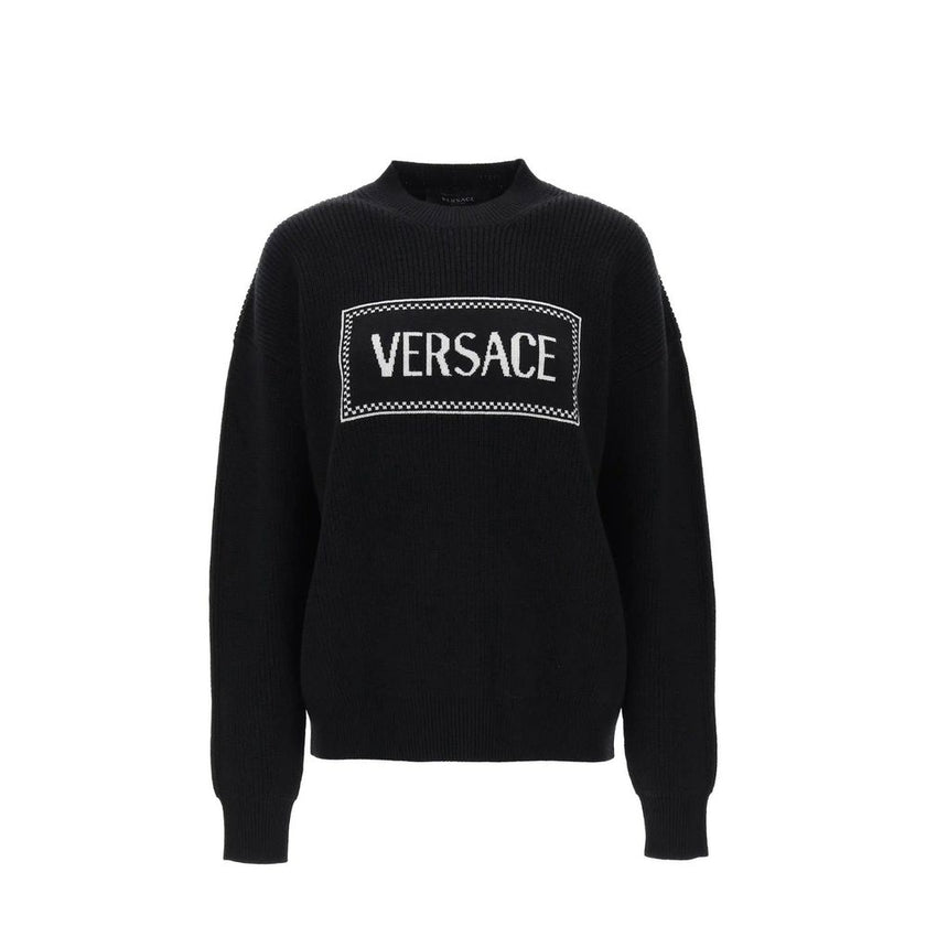Black Wool SweatshirtDescription: – Composition: 100% Wool – Long sleeves – Round neck – Ribbed trims – The model is 177 cm tall and wears size IT 38 – Made in Italy – Gender: WOMEN –Black Wool Sweatshirt${tagsVersaceAulae Logo Sweater VersaceAulae Logo S