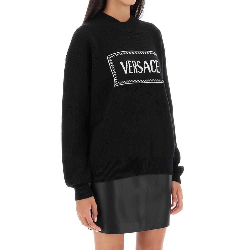 Black Wool SweatshirtDescription: – Composition: 100% Wool – Long sleeves – Round neck – Ribbed trims – The model is 177 cm tall and wears size IT 38 – Made in Italy – Gender: WOMEN –Black Wool Sweatshirt${tagsVersaceAulae Logo Sweater VersaceAulae Logo S