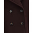 Bordeaux Fleece Wool CoatThe Oversized Double-Breasted Coat in wool stands out for its enveloping silhouette and the use of iconic soft wool that combines comfort and structure. The design is elevated by a chin-strap collar, engraved horn buttons placed a