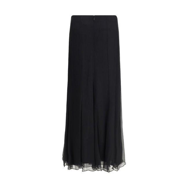 Black Silk Long SkirtThe Silk Long Skirt by Chloé embodies femininity with lightness and refinement. The fluid fit flows naturally with movement, while the back zip closure preserves the clean silhouette. An essential and sophisticated piece, perfect for