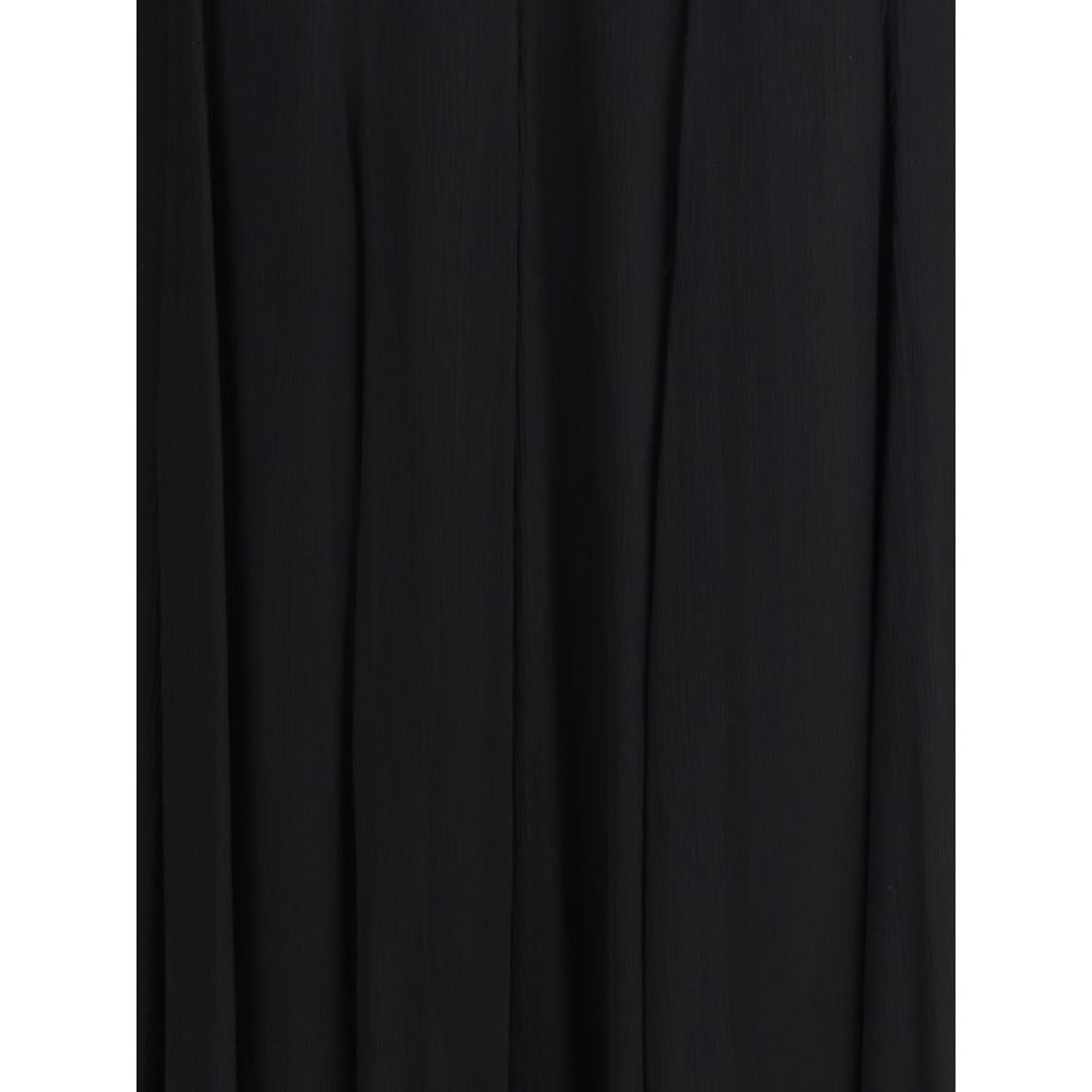 Black Silk Long SkirtThe Silk Long Skirt by Chloé embodies femininity with lightness and refinement. The fluid fit flows naturally with movement, while the back zip closure preserves the clean silhouette. An essential and sophisticated piece, perfect for