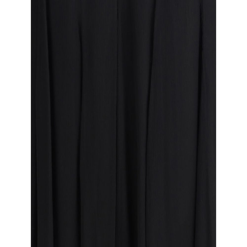 Black Silk Long SkirtThe Silk Long Skirt by Chloé embodies femininity with lightness and refinement. The fluid fit flows naturally with movement, while the back zip closure preserves the clean silhouette. An essential and sophisticated piece, perfect for