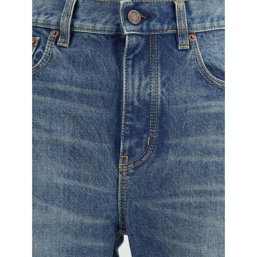 Blue Cotton Straight-Leg JeansThe Organic Cotton Straight-Leg Denim Jeans by Chloé combine tradition and modernity with a refined indigo wash and a slit hem that adds movement to the silhouette. The front zip and Chloé-engraved button fastening enrich the