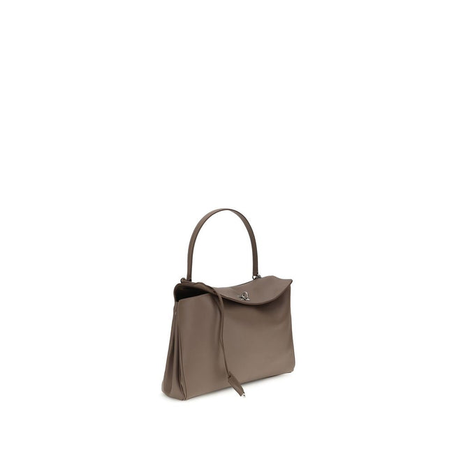 Gray Calf Leather Bos Taurus Shoulder BagBalenciaga’s Rodeo Leather Shoulder Bag features a top handle for a comfortable and stylish grip. The front closure features a flap and swivel, adding a distinctive and functional detail. Applied keychain detail on
