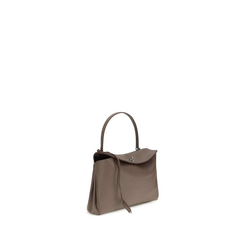 Gray Calf Leather Bos Taurus Shoulder BagBalenciaga’s Rodeo Leather Shoulder Bag features a top handle for a comfortable and stylish grip. The front closure features a flap and swivel, adding a distinctive and functional detail. Applied keychain detail on