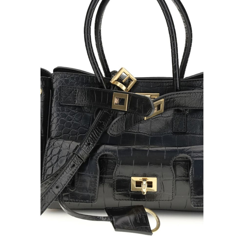 Bel Air mini Shoulder BagBalenciaga’s Bel Air mini Shoulder Bag is made of calfskin leather with crocodile processing, combining sophistication and iconic design. The carry-all model features two handles joined by a clip and an adjustable, removable shoul
