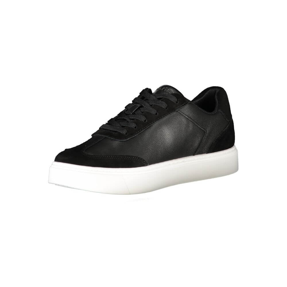 Black Leather Men SneakerIndulge in the sleek sophistication of Calvin Klein with these athletic sneakers that exude style in every step. Designed for the fashion-forward individual, these kicks boast contrasting black accents and a bold CK logo that assu