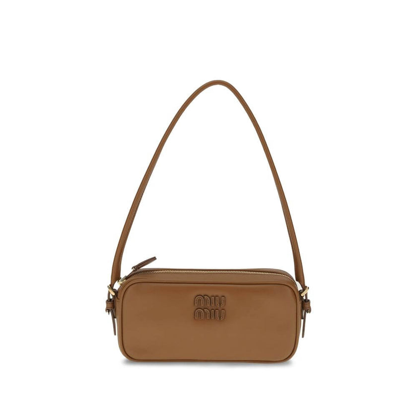 Brown Calf Leather Bos Taurus Shoulder BagShoulder Bag by Miu Miu is an elegant, minimalist accessory made of soft leather and embellished with tonal logo applique on the front, adding a discreet yet distinctive touch. Equipped with a round leather handle