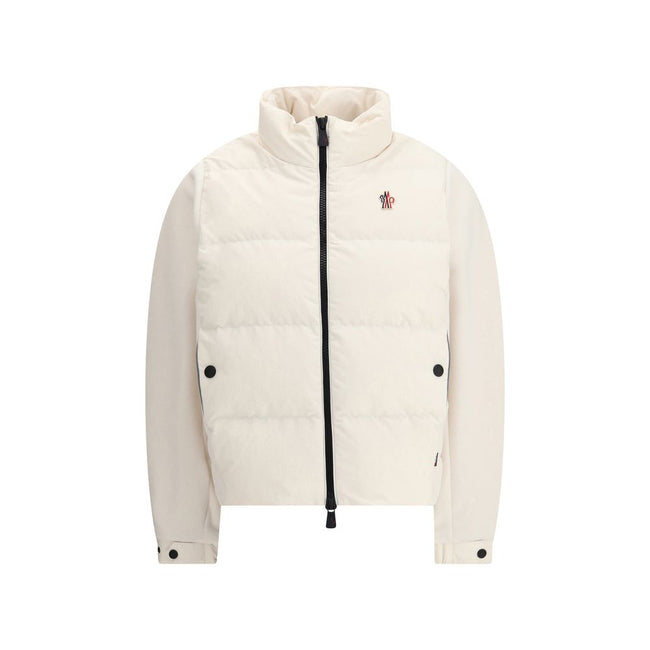 Jacket with sleeves in contrastZip Jacket by Moncler Grenoble combines lightness and performance thanks to down-filled longue saison nylon, which provides warmth without weighing down. The raised collar and black zipper emphasize a sporty, essential desig
