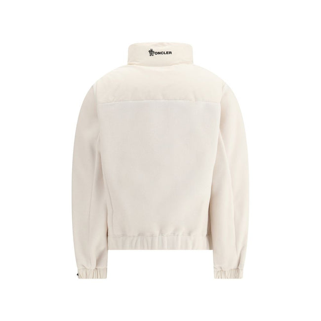Jacket with sleeves in contrastZip Jacket by Moncler Grenoble combines lightness and performance thanks to down-filled longue saison nylon, which provides warmth without weighing down. The raised collar and black zipper emphasize a sporty, essential desig