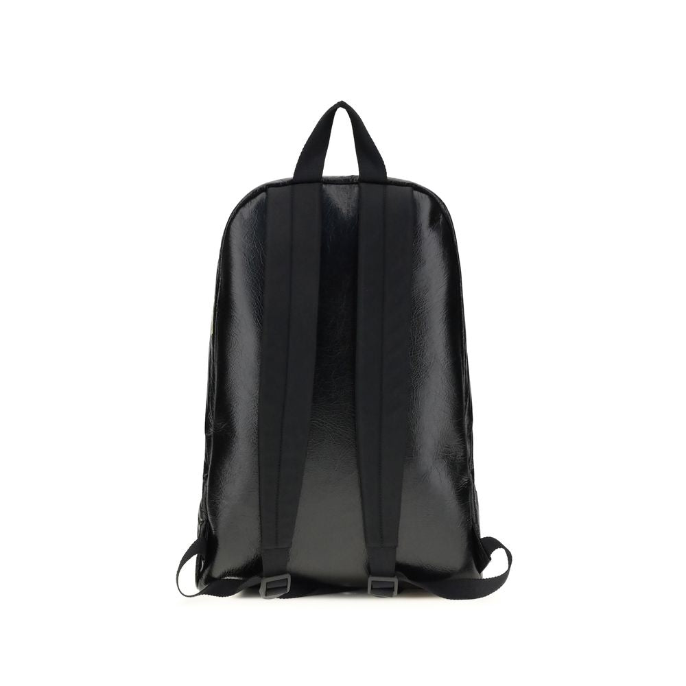 Black Lamb Ovis Aries Aries BackpackThe Explorer Backpack by Balenciaga is crafted from soft Arena lambskin, embellished with printed stickers for a distinctive, graphic touch. Featuring a top handle and adjustable shoulder straps, it features a two-way z