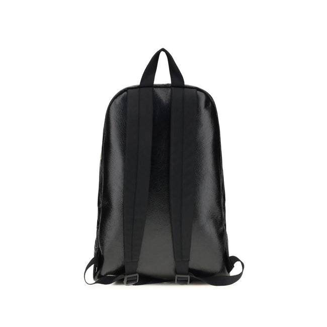 Black Lamb Ovis Aries Aries BackpackThe Explorer Backpack by Balenciaga is crafted from soft Arena lambskin, embellished with printed stickers for a distinctive, graphic touch. Featuring a top handle and adjustable shoulder straps, it features a two-way z