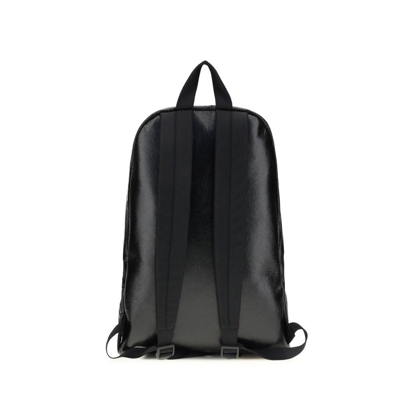 Black Lamb Ovis Aries Aries BackpackThe Explorer Backpack by Balenciaga is crafted from soft Arena lambskin, embellished with printed stickers for a distinctive, graphic touch. Featuring a top handle and adjustable shoulder straps, it features a two-way z