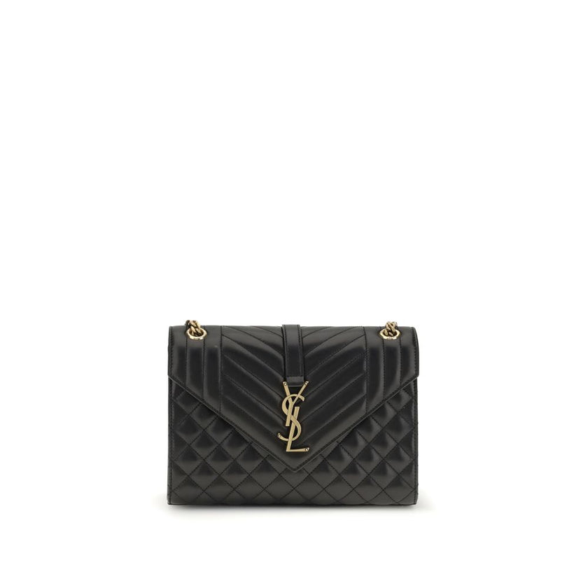 Black Calf Leather Bos Taurus Shoulder BagEnvelope medium Shoulder Bag by Saint Laurent is a timeless icon defined by elegant quilted chevron stitching, checks and vertical lines. The leather shoulder strap with sliding chain allows it to be worn on the s