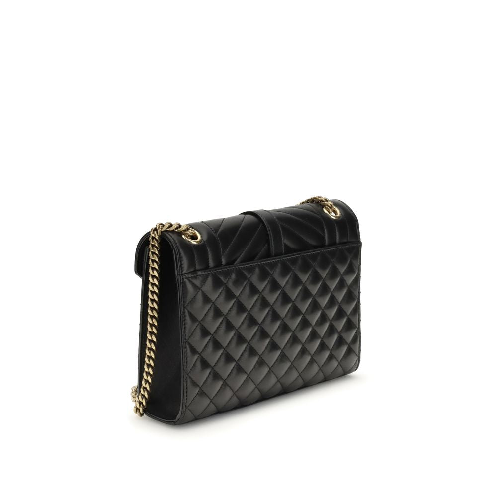 Black Calf Leather Bos Taurus Shoulder BagEnvelope medium Shoulder Bag by Saint Laurent is a timeless icon defined by elegant quilted chevron stitching, checks and vertical lines. The leather shoulder strap with sliding chain allows it to be worn on the s