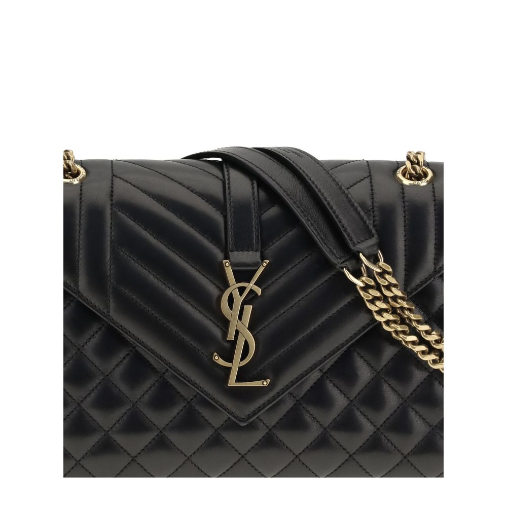 Black Calf Leather Bos Taurus Shoulder BagEnvelope medium Shoulder Bag by Saint Laurent is a timeless icon defined by elegant quilted chevron stitching, checks and vertical lines. The leather shoulder strap with sliding chain allows it to be worn on the s