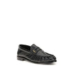Black Lamb Ovis Aries Aries Slip-On LoafersLe Loafer Loafers by Saint Laurent combine classic elegance and iconic details. Crafted from supple leather, they feature a hand-stitched moc toe and the signature CASSANDRE embellishment in gold-tone metal. The