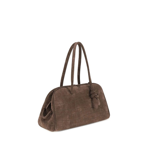 Il Turismo Shoulder BagThe Il Turismo Shoulder Bag by Jacquemus reinterprets the classic bowling bag with a contemporary twist. Crafted from crocodile-embossed suede, it features a two-way zip closure and matching tubular leather handles with a knotted de