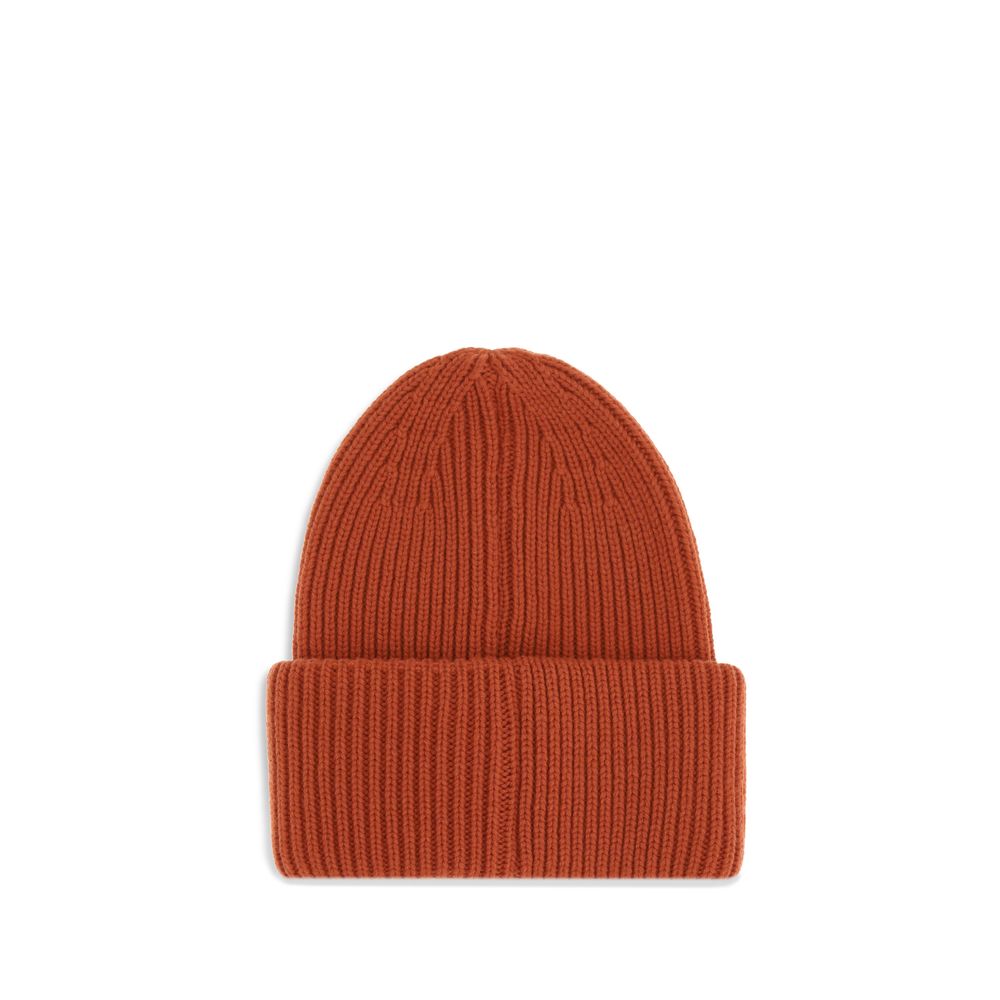 Red Wool BeanieThe beanie Hat by Moncler is crafted from a wool and cashmere blend with a brioche stitch that enhances its softness and style. The heavy knit ensures warmth and comfort, while the iconic felt patch on the front adds a distinctive and recog