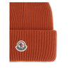 Red Wool BeanieThe beanie Hat by Moncler is crafted from a wool and cashmere blend with a brioche stitch that enhances its softness and style. The heavy knit ensures warmth and comfort, while the iconic felt patch on the front adds a distinctive and recog